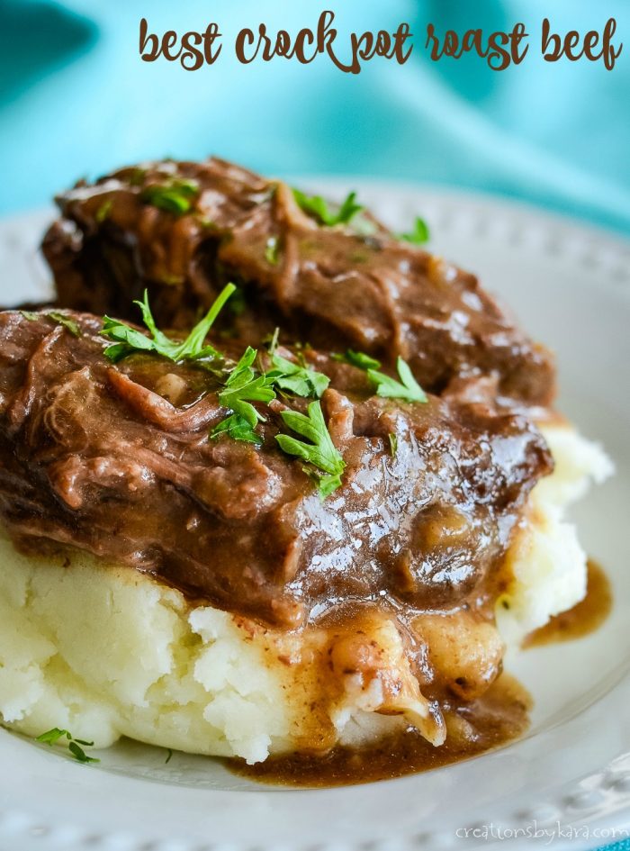 crockpot roast beef with gravy over mashed potatoes
