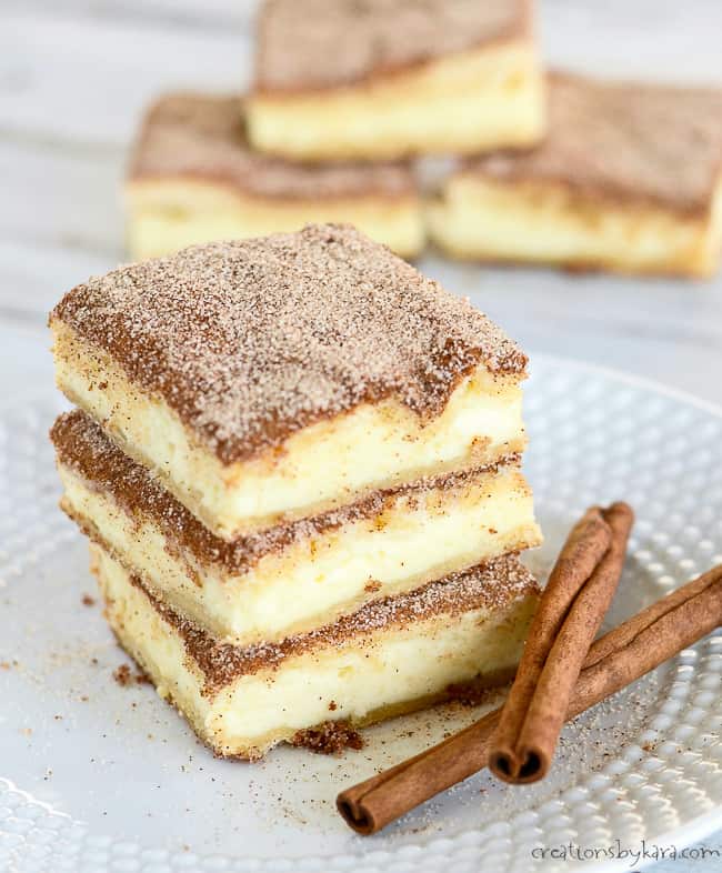 Churro Cheesecake Bars Recipe - Creations by Kara