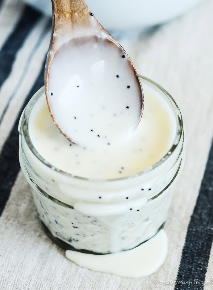 close up of spoonful of creamy poppyseed dressing
