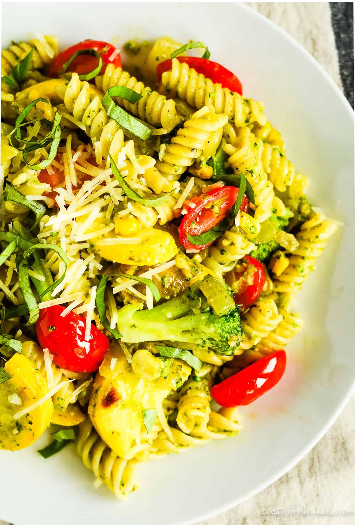 plate of pesto pasta recipe with vegetables