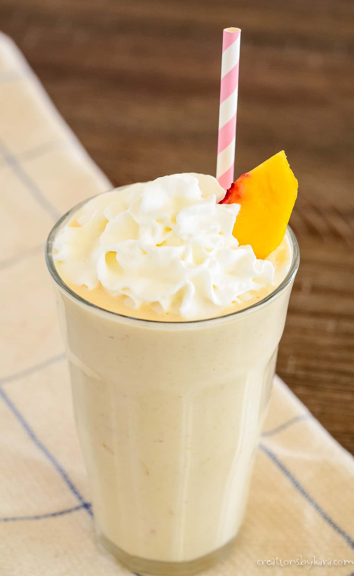 fresh peach milkshake with whipped cream