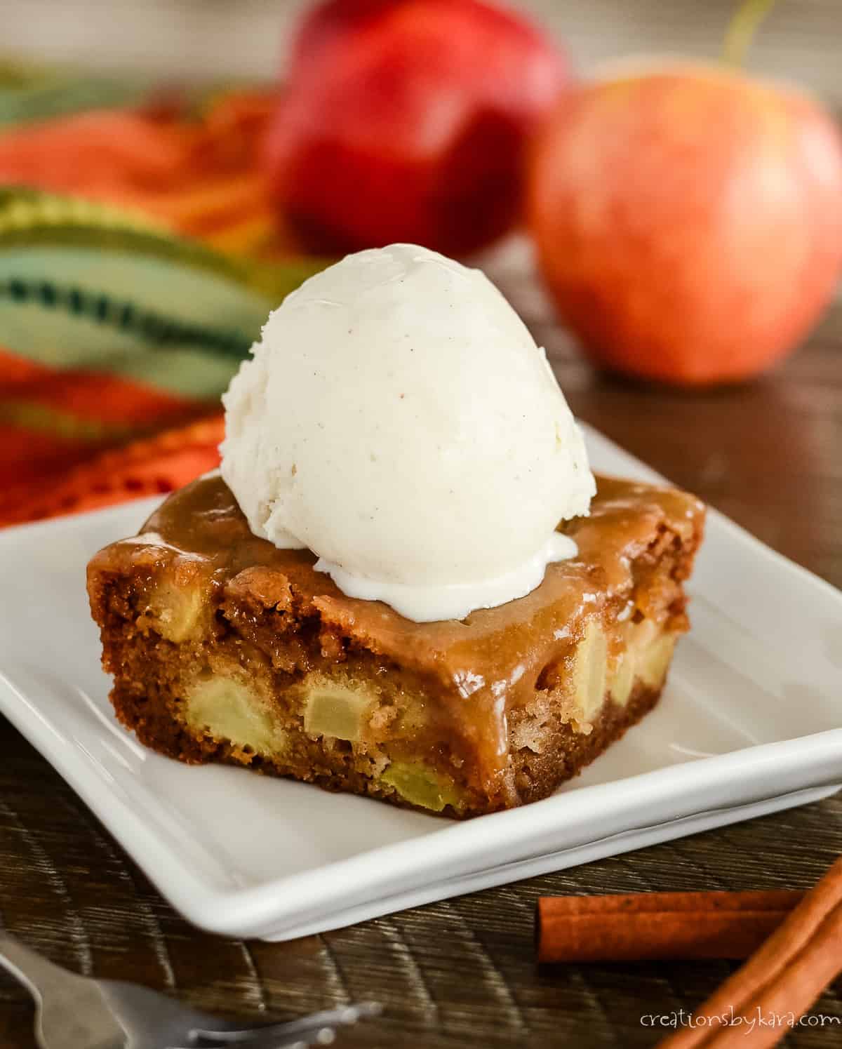 slice of apple cake with caramel glaze and ice cream