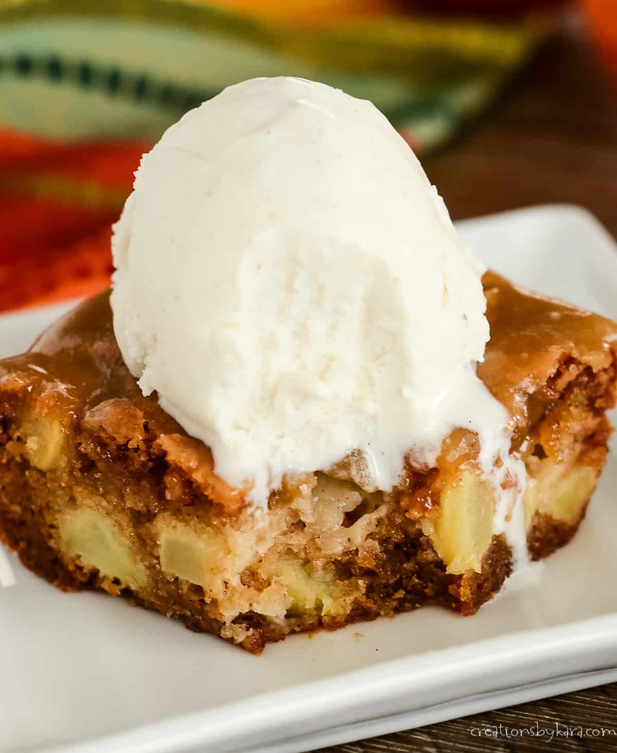 caramel glazed apple cake with a bite taken out of it