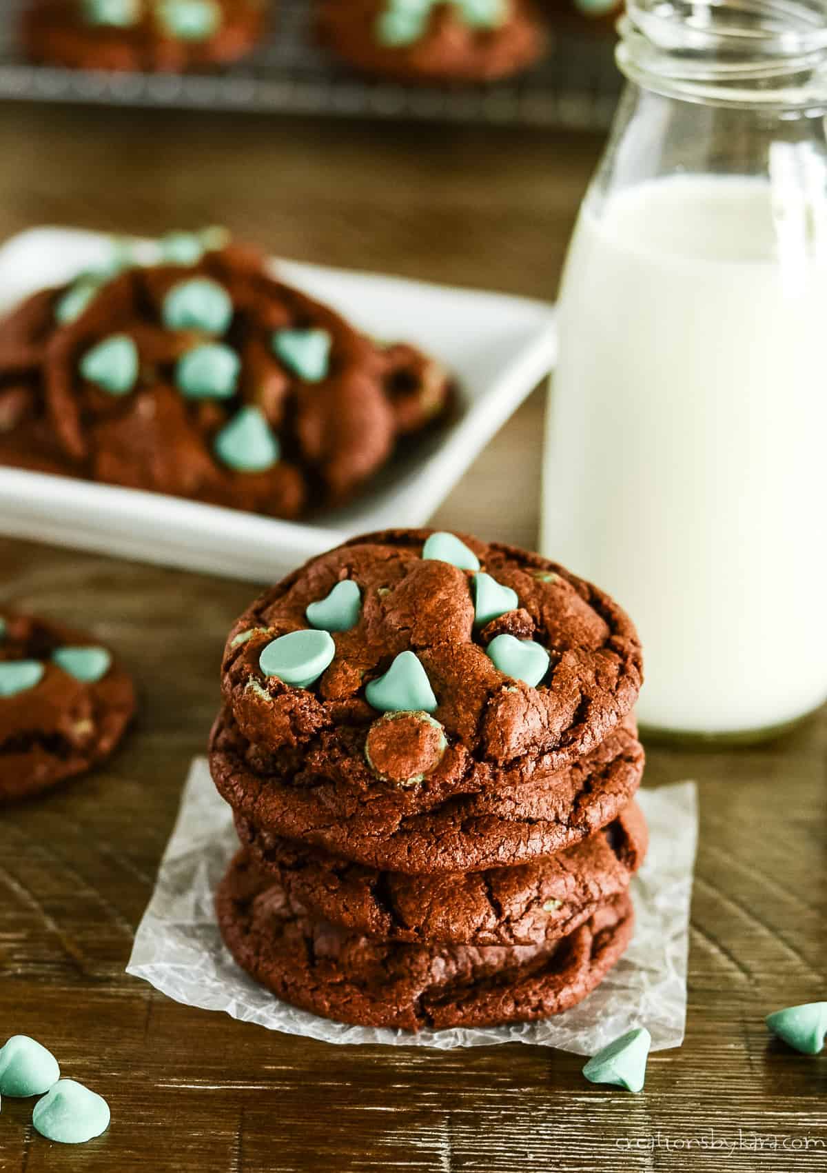 chocolate mint chip cookies with a glass of milk