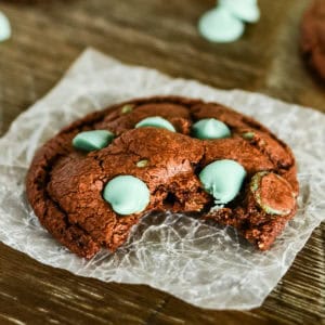 chocolate mint chip cookie with a bite taken out of it