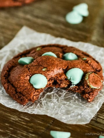 chocolate mint chip cookie with a bite taken out of it