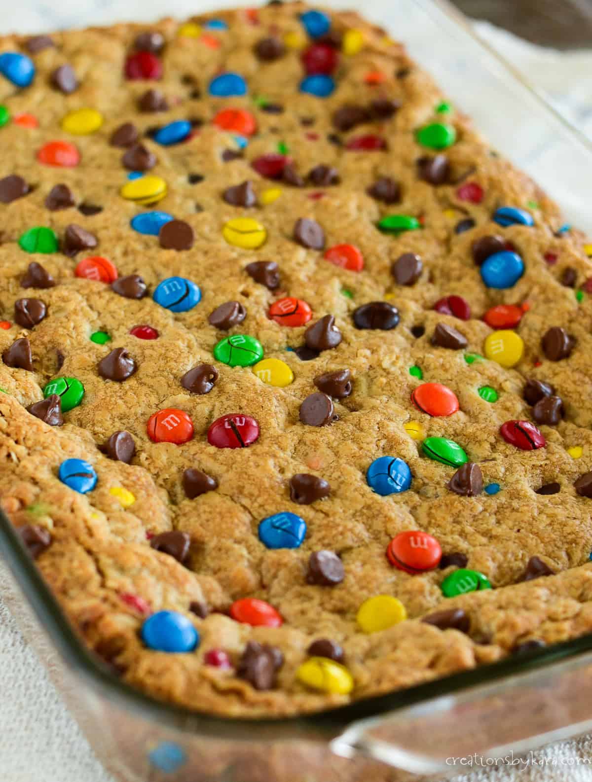 pan of monster cookie bars with m&m's