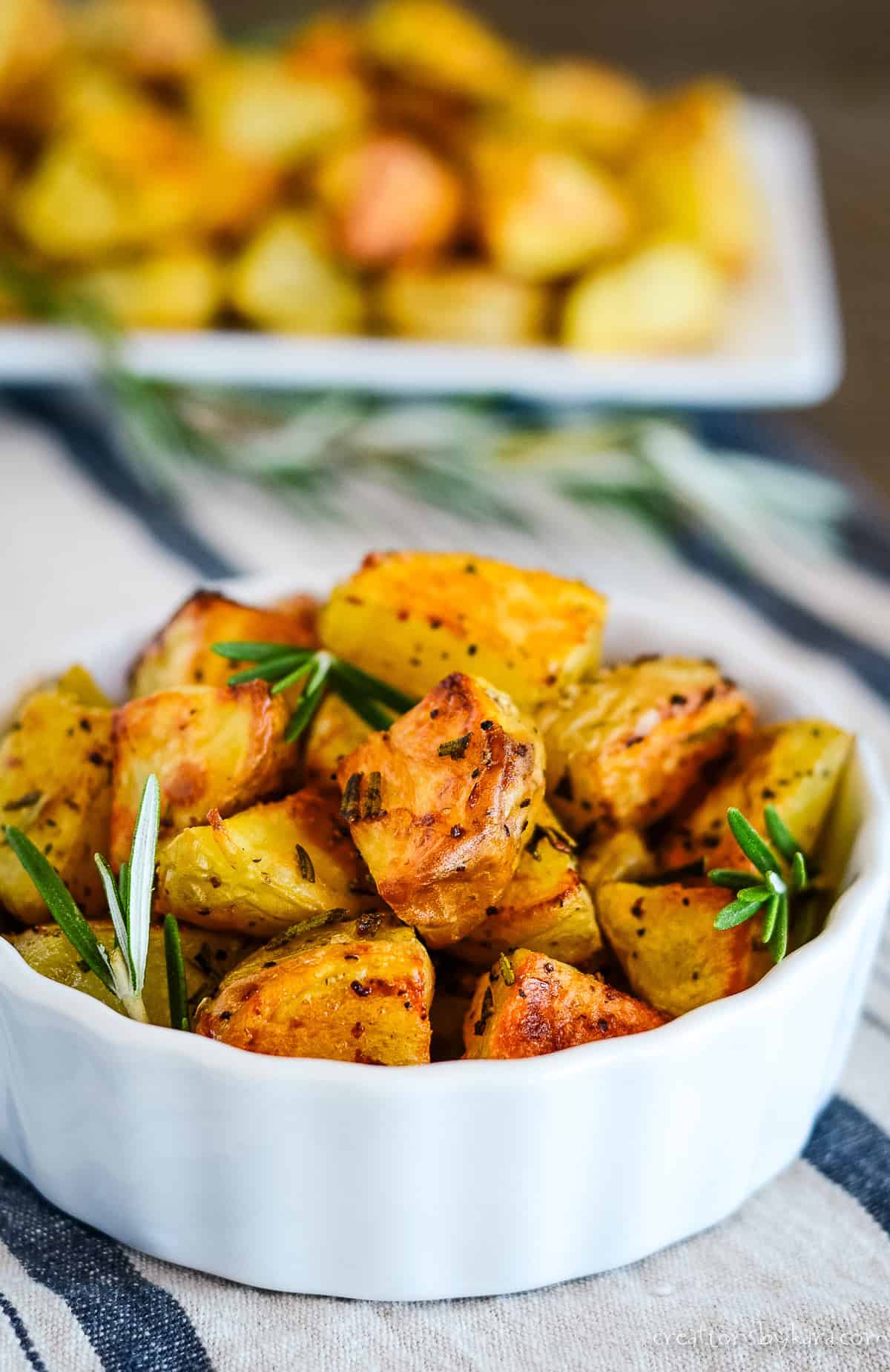 bowl of roasted potatoes with rosemary