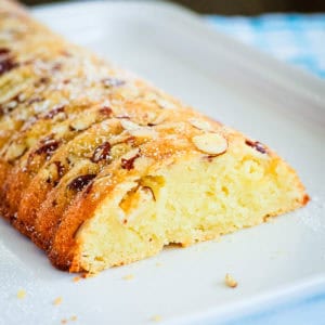 sliced scandinavian almond cake topped with almonds