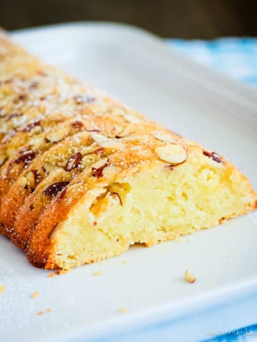 sliced scandinavian almond cake topped with almonds