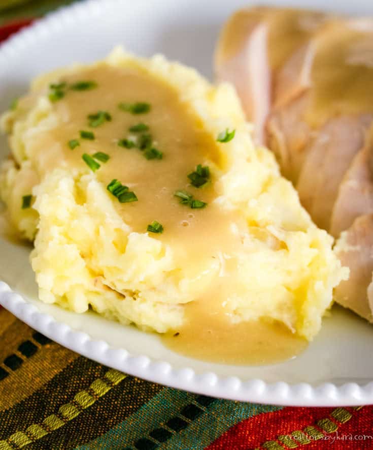 turkey gravy with drippings over mashed potatoes