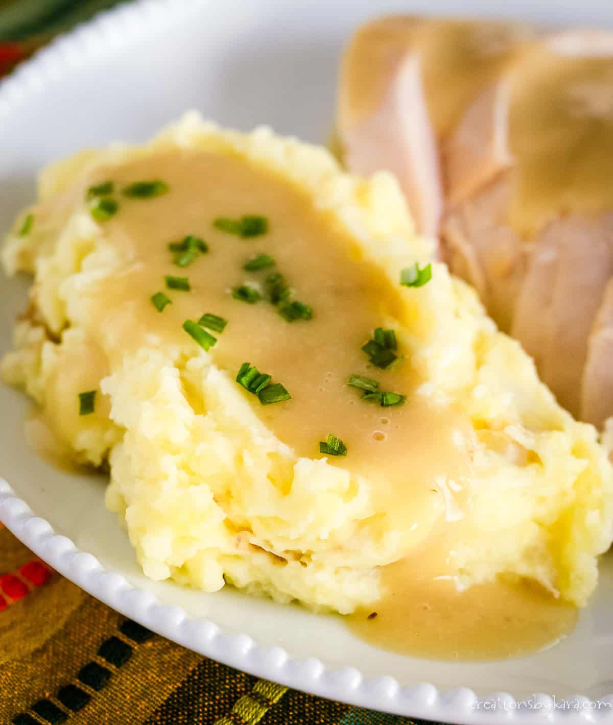 mashed potatoes topped with turkey gravy from drippings