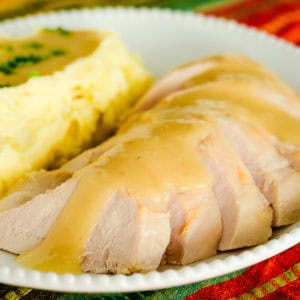 plate of sliced toasted turkey with gravy