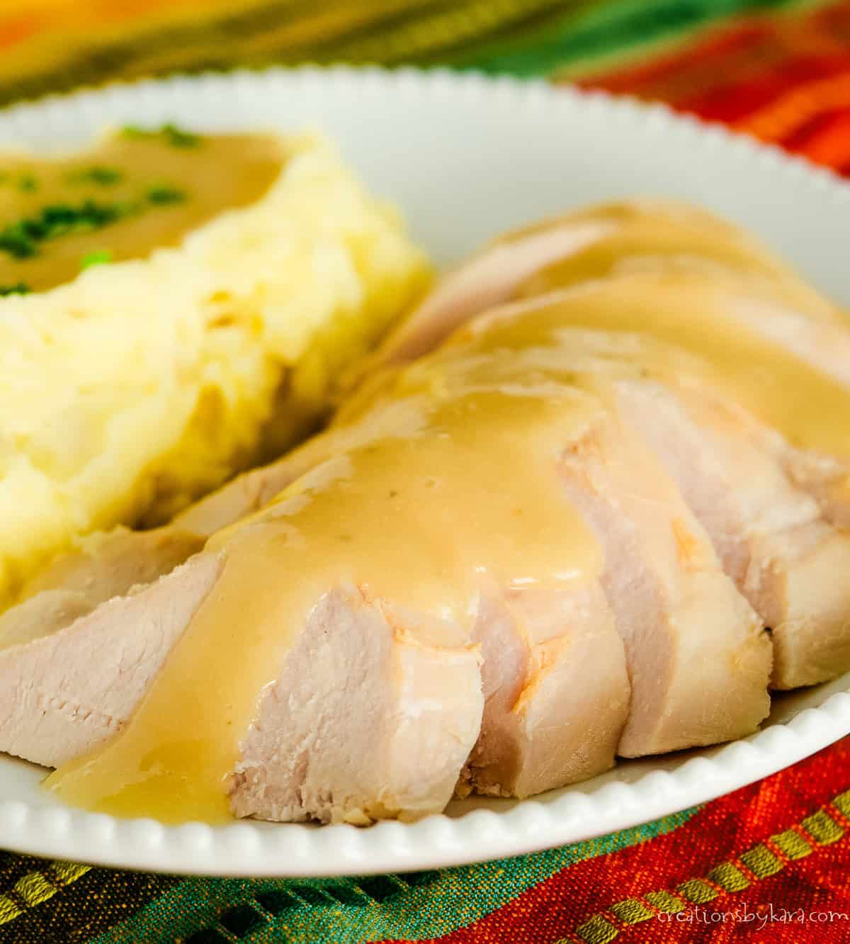 plate of sliced toasted turkey with gravy