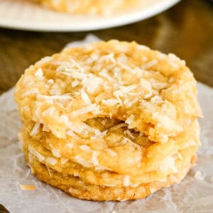 stack of coconut cookies on waxed paper