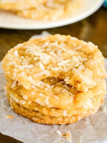 stack of coconut cookies on waxed paper