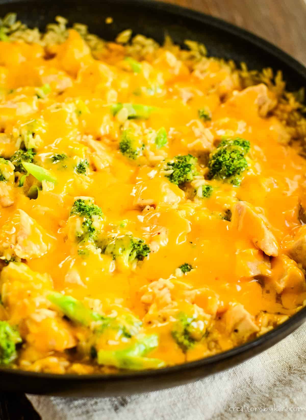 skillet of cheesy chicken broccoli rice